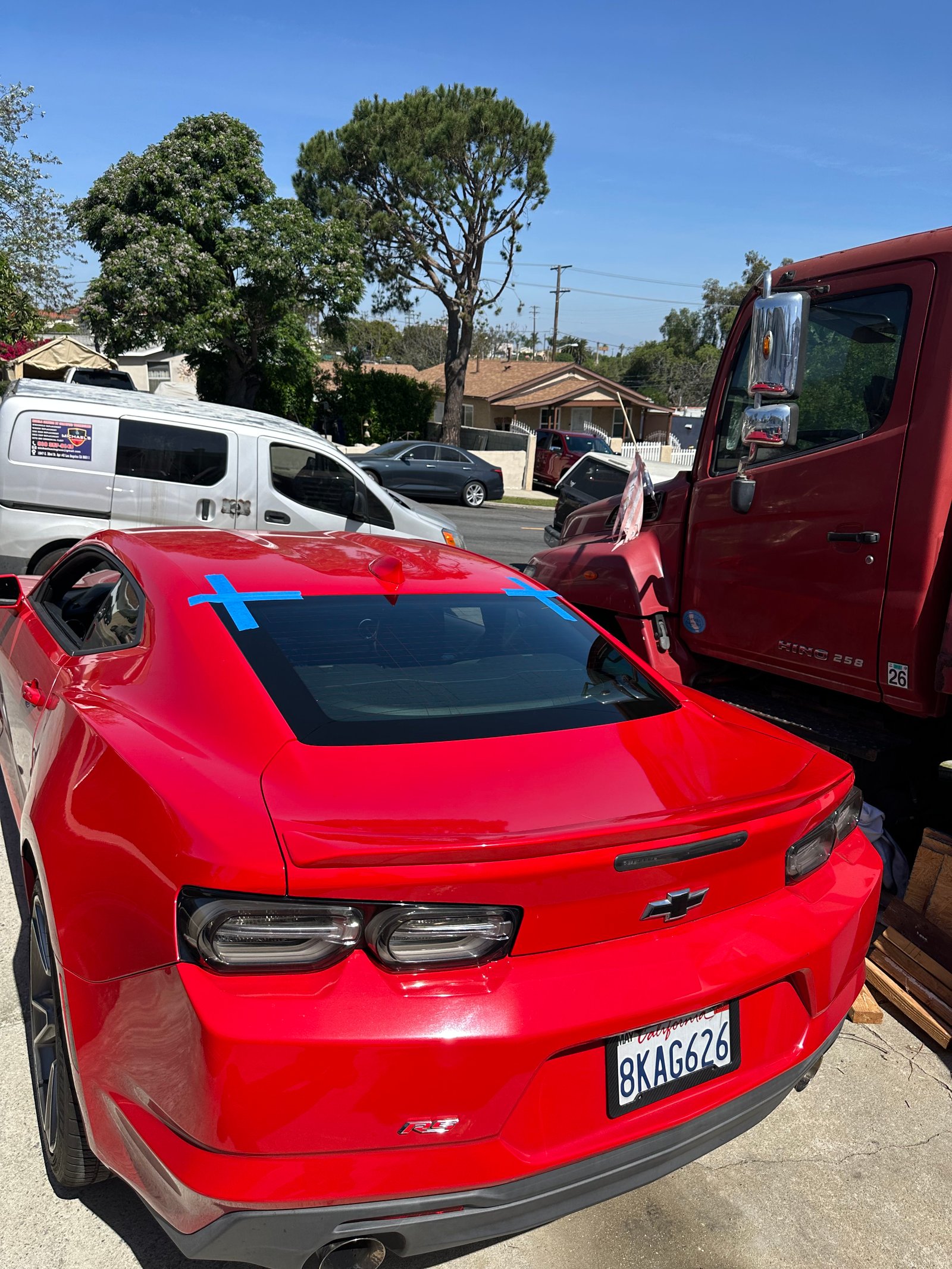 Red Chevrolet Camaro windshield replacement near Port of Los Angeles in Wilmington, CA